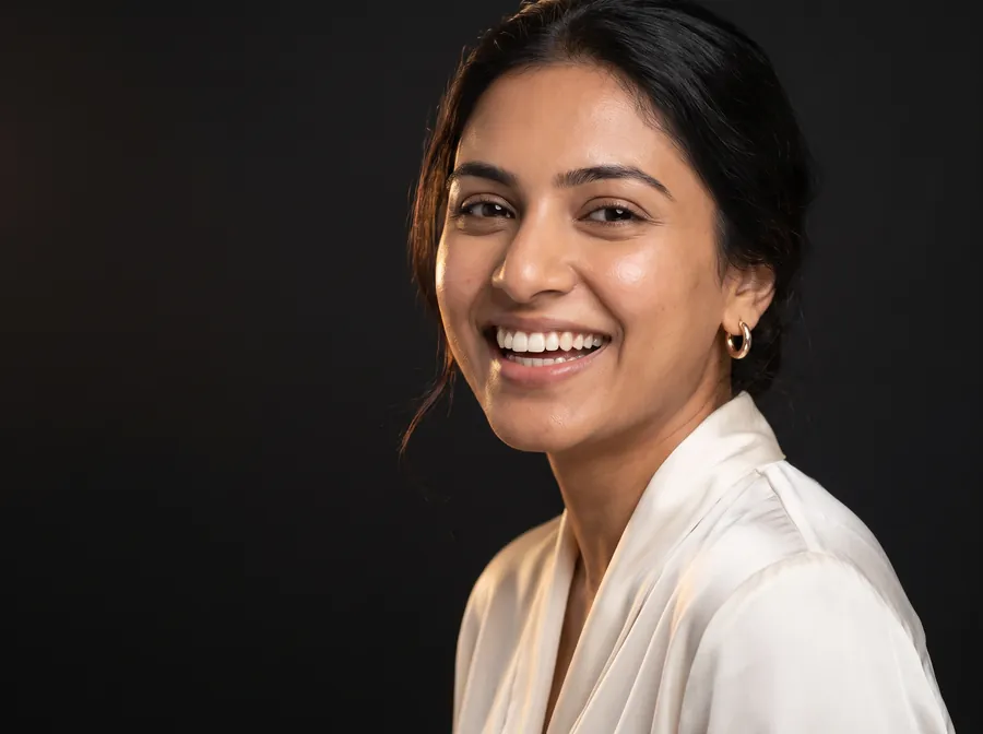 A woman with a natural, confident smile